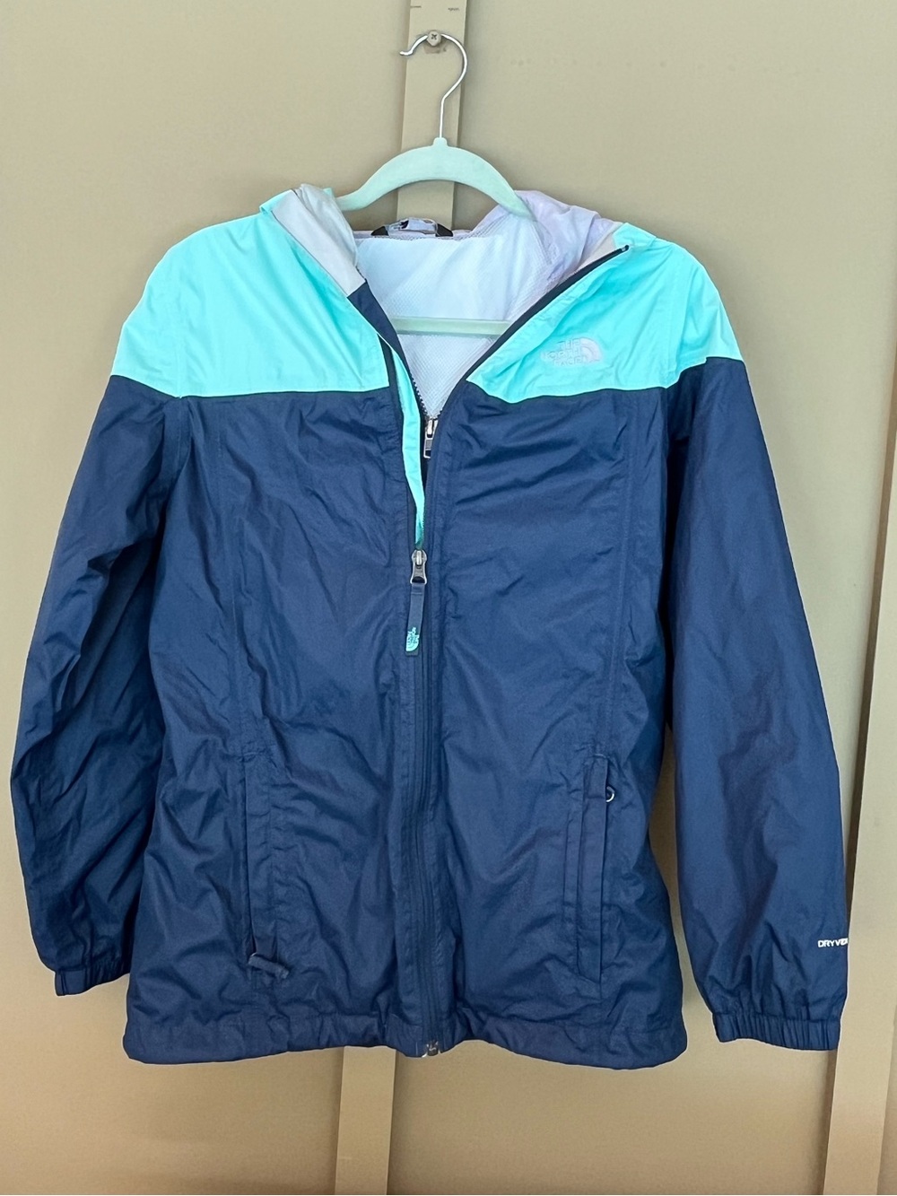 girl’s blue rainjacket
